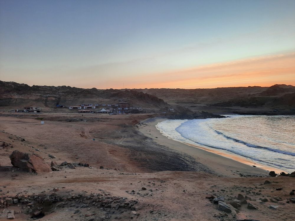 Rugged Pacific coastline of Peru with steep cliffs, rocky shores and ocean views.